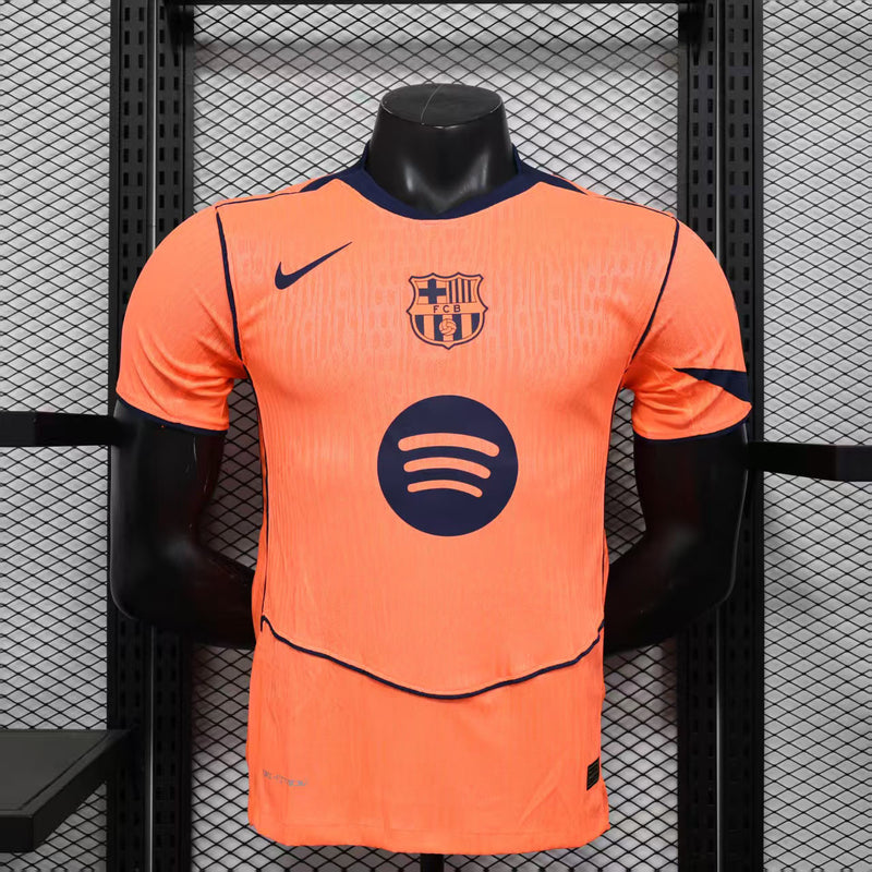 CAMISOLA VERSÃO PLAYER DO BARCELONA 25/26 LARANJA E PRETO